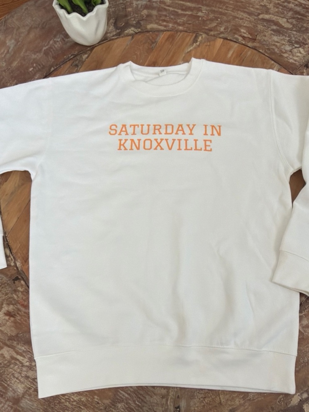 White Sweatshirt with Orange "Saturday in Knoxville" Text